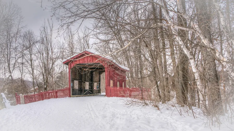 11 Mountain Towns That Are Even Prettier in Winter Than in Summer Photograph Stowe's Steeple and Covered Bridge